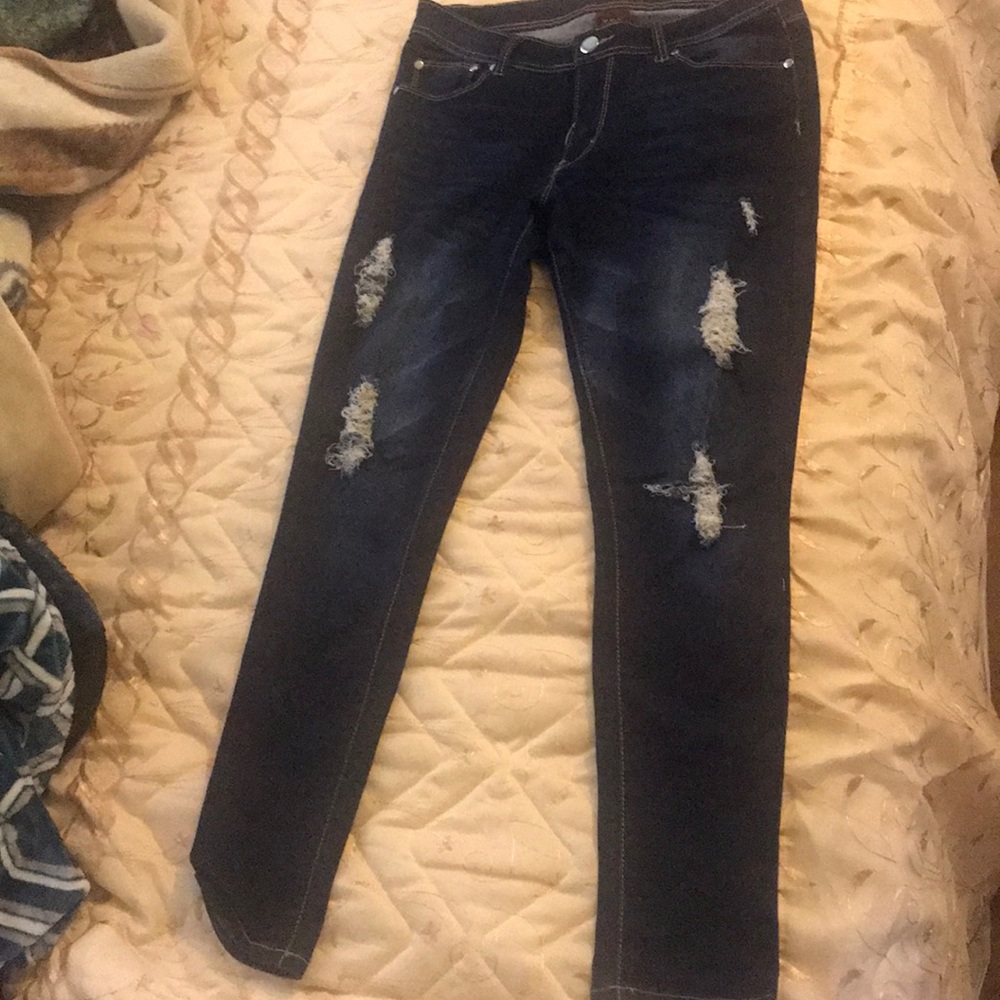 Ripped dark blue jeans